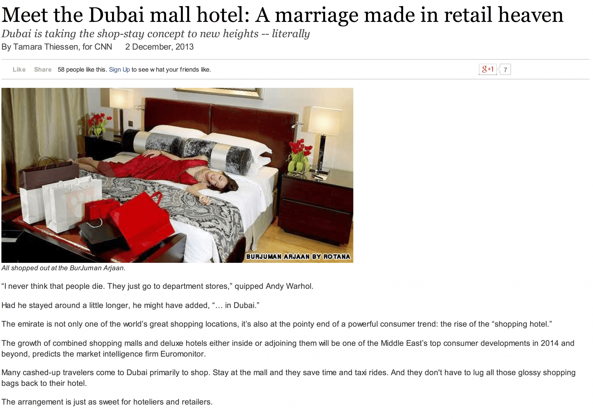 A hotel bed with clothing and shopping bags on it in a story on ritzy mall hotels in Dubai for CNN Travel by Tamara Thiessen