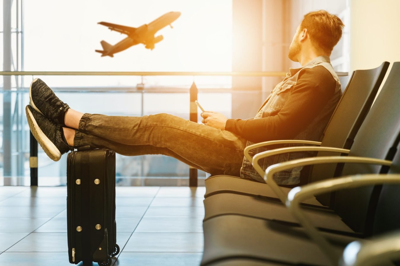 Traveler waits as few plans take off due to US Covid travel ban