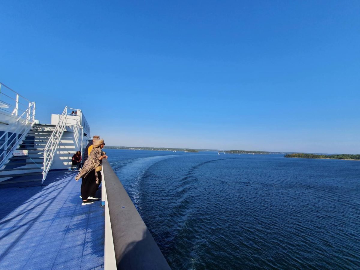 people gaze at Stockholm archipelago Sweden from ship