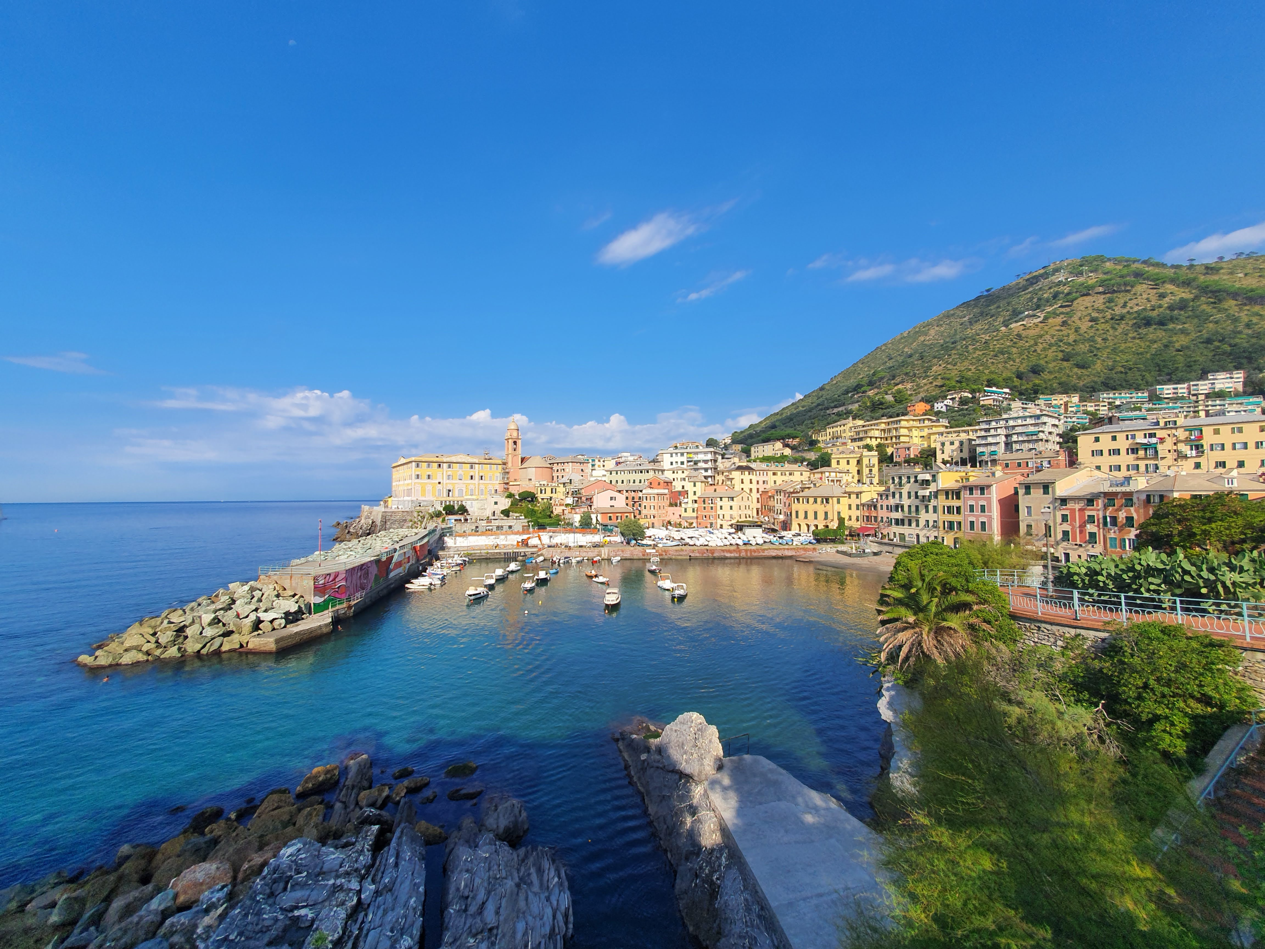 Genoa and its coastline with blue skies and ports