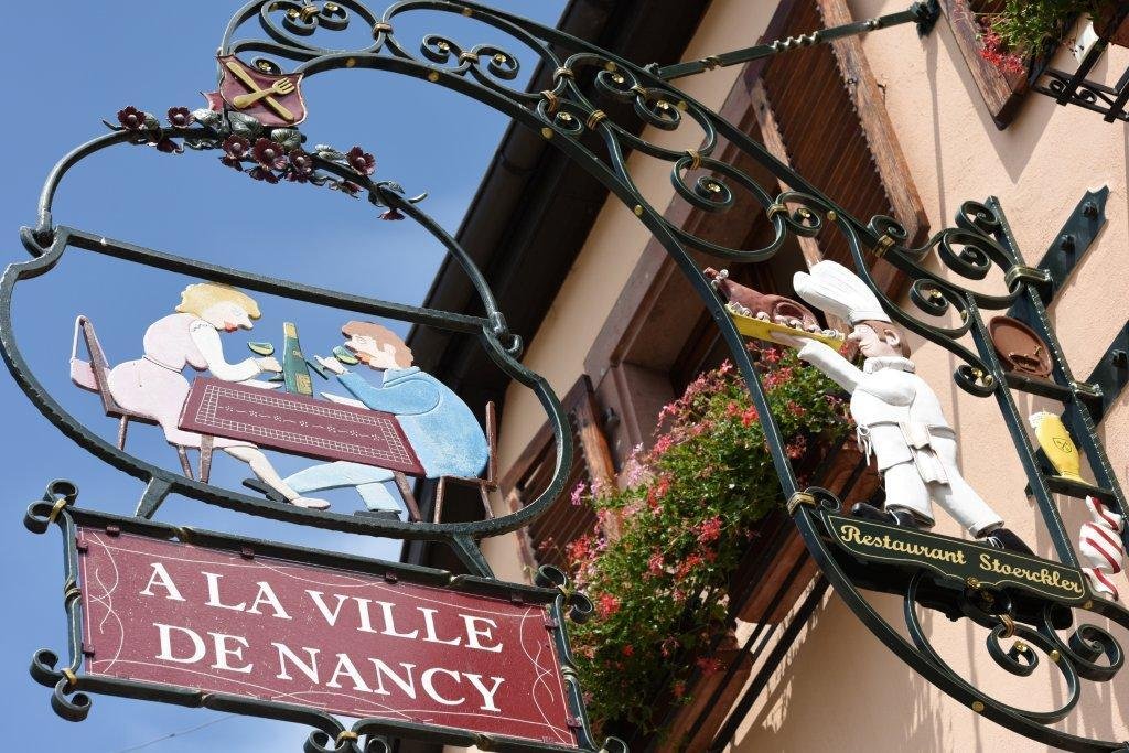 A La Ville de Nancy sign in Eguisheim France photo  by Tamara Thiessen travel writer and journalist who lives in and writes about France